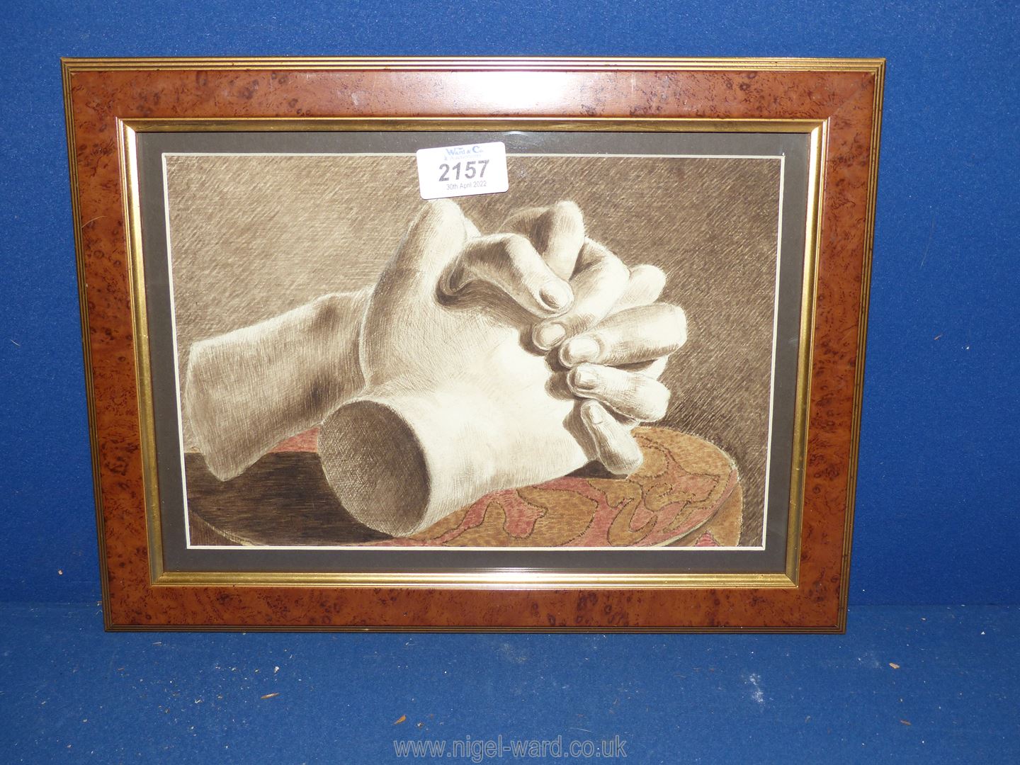 A framed Watercolour of clasping hands.