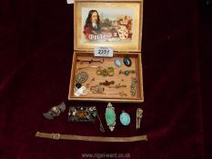 A small cigar box and contents of micro mosaic brooches, Turquoise pendant, green coral brooch,