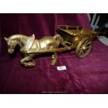 A large and heavy brass horse and cart.