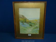 A framed and mounted Watercolour of a coastal landscape, signed lower right M.E.