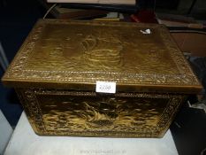 A brass slipper box with nautical scenes.