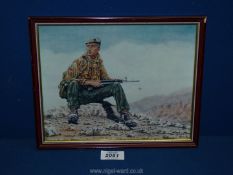 A small framed Print by John Tidewell of a SAS soldier in the desert.