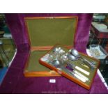 A cutlery box containing forks, teaspoons, Mother of Pearl handled cake slice, serving spoons etc.