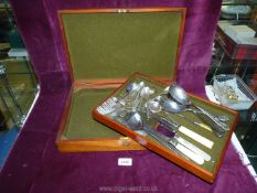 A cutlery box containing forks, teaspoons, Mother of Pearl handled cake slice, serving spoons etc.