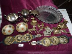 A quantity of mixed metals, white metal tray, candlesticks, horse brasses, jug and saucer, bowl,