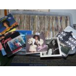 A large quantity of 7" vinyl records to include Whitesnake, Vanhalen, Tears for Fears,