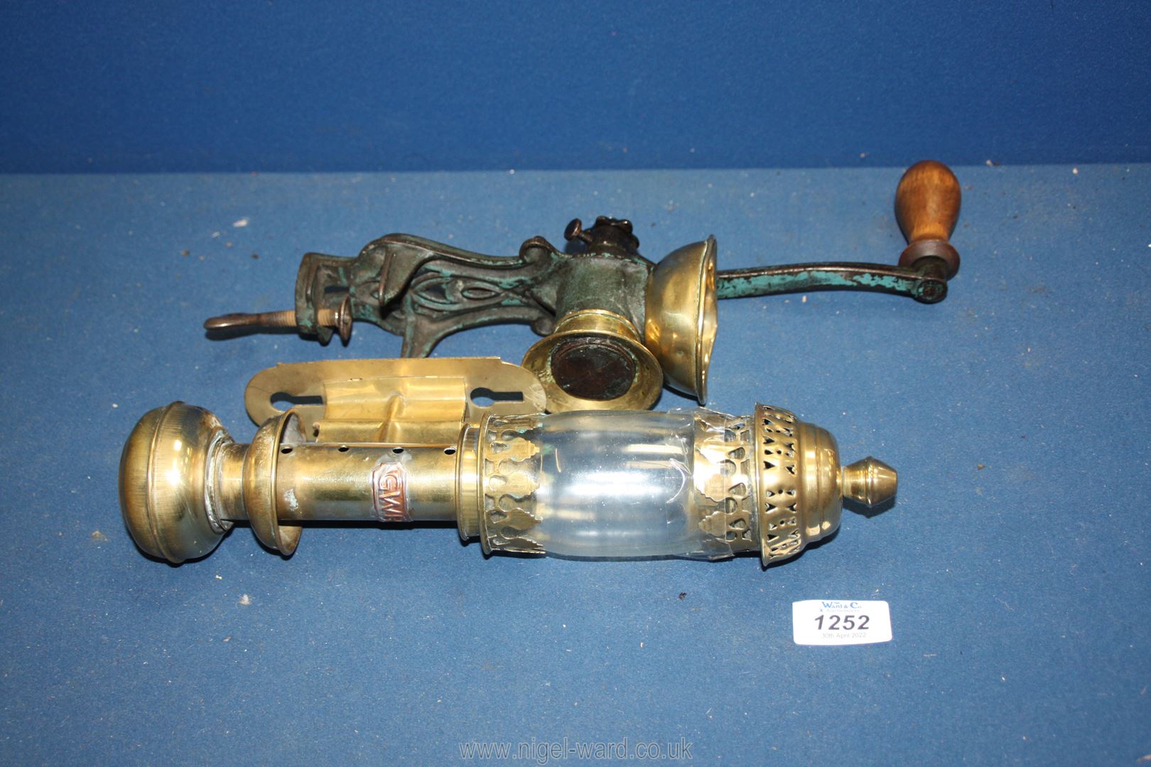 A brass and iron coffee grinder and a G.W.R. hanging brass oil Lamp, a/f, 12'' tall.