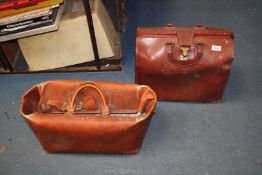 Two brown leather Gladstone bags, one a/f.