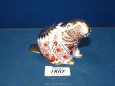 A Royal Crown Derby Beaver paperweight with silver stopper.