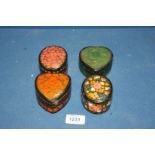 Four small papier mache trinket Pots in floral patterns, two marked 'Made in India', a/f.