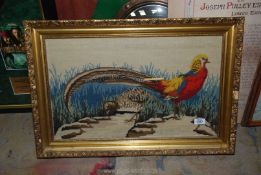 A gilt framed tapestry of a Pheasant, 27'' wide x 18 1/2''.