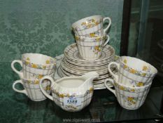 A Spode 'Buttercup' part tea service, six each cups, saucers, tea plates and milk jug.