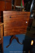 A Mahogany snap-top occasional Table having a square one plank top,