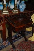 A fine Rosewood Workbox table, the top having an intricately fretworked upstand,