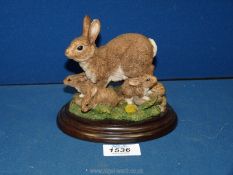 A Royal Doulton mother and baby rabbits figure.