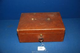 A brown hide bound jewellery/writing Case with the initials "C.W.J.
