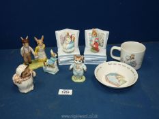 A quantity of Beatrix Potter ornaments including Bunnykins mug and bowl, music boxes,