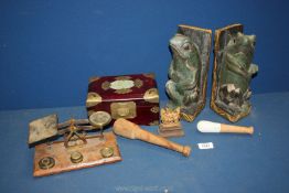 A quantity of miscellanea including scales, pestles, colourful frog bookends,