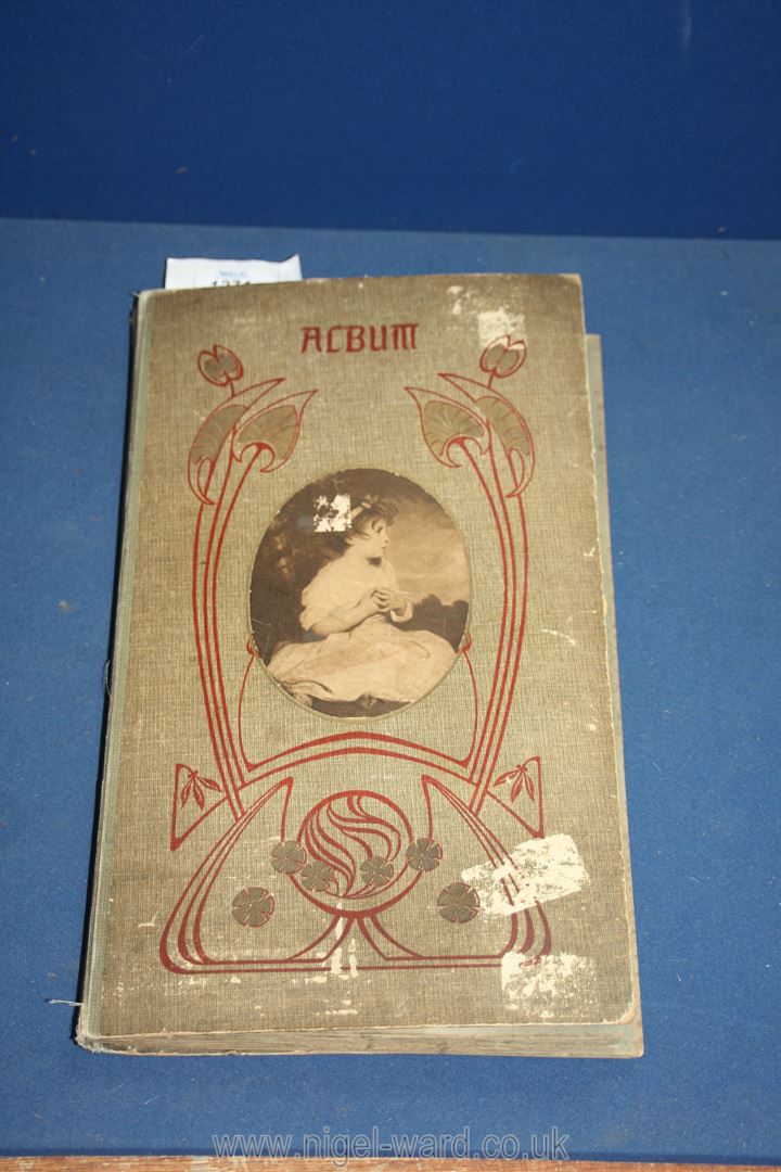 An Album containing a good quantity of Postcards and greetings cards, some Edwardian.