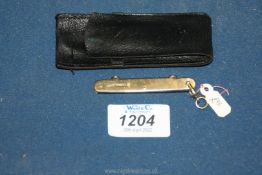 A 9ct. Gold Penknife dated 1912, in soft leather case.