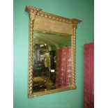 A gilt framed wall/over-mantel Mirror in the traditional Georgian style with mirrored twist column