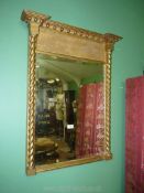 A gilt framed wall/over-mantel Mirror in the traditional Georgian style with mirrored twist column