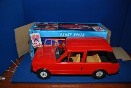 A Sindy Range Rover in red,