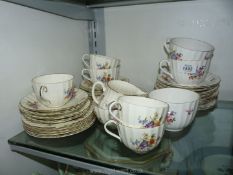 A quantity of Royal Worcester 'Roanoke' china including breakfast and teacups and saucers,