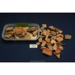 Two small boxes of pottery fragments from the vicinity of an archaeological dig,