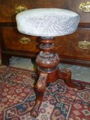 An elegant Walnut three legged based Piano Stool,