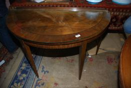 A Mahogany/Walnut "D" shaped side Table having a cross-banded top,