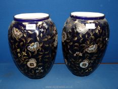 A pair of dark blue hand-painted Vases with raised flowers in turquoise and gold 13" tall,