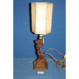 An Art Deco style glass lamp depicting a semi-clad female figure, 18'' tall.