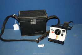 A cased Polaroid 1000 Land Camera.