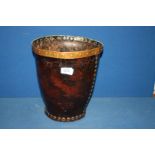 An early, believed 18th century, copper rimmed leather fire-bucket of riveted construction,
