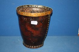 An early, believed 18th century, copper rimmed leather fire-bucket of riveted construction,