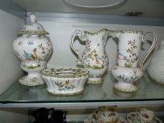 Four pieces of white and green china with stylised bird motifs including jugs,