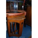 An unusual Oak Arts and Crafts Corner Stick Stand having a fretworked central slab support,