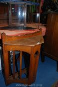 An unusual Oak Arts and Crafts Corner Stick Stand having a fretworked central slab support,