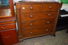 A circa 1900 Oak Chest of three long and two short drawers having turned wooden knobs and spiral