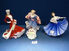 Four Royal Doulton figurines including 'Christmas Day', 'Elaine',