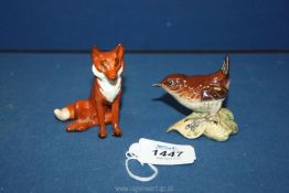 A Beswick model of a seated fox and a Beswick model of a wren.