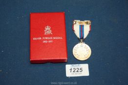 A 1977 Silver Jubilee medal in original box.