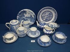 A quantity of blue and white china in willow pattern: cups,saucers teapots, butter dish (a/f) etc,