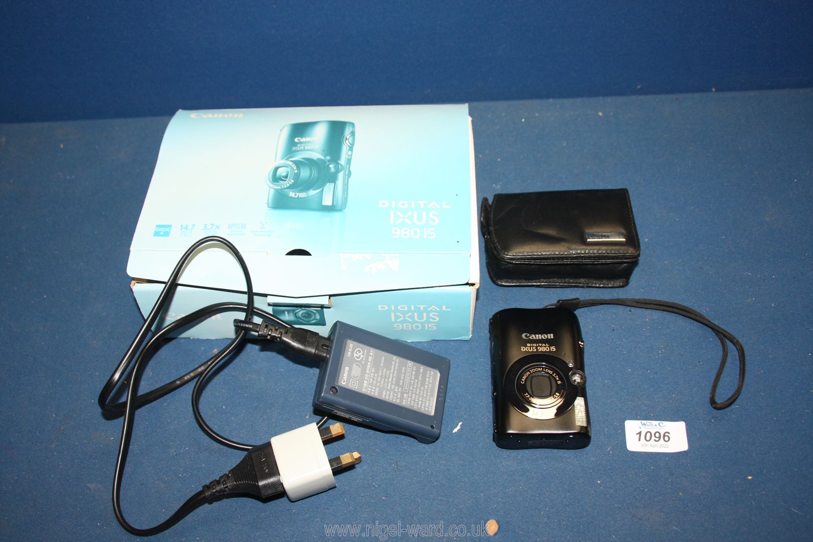 A Canon digital IXUS 9801S camera 14.7 mp. including case and box, with battery charger.