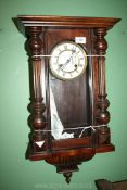 A Victorian wall Clock with Roman numerals. 26 1/2'' high overall x 14'' wide.