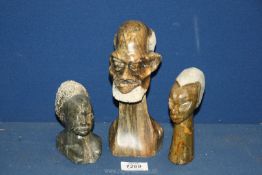 Three carved stone Ethnic heads, (some chips), 8'', 5 1/4'' and 4'' tall.