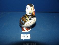 A Royal Crown Derby Puffin paperweight with gold stopper.