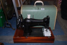 A cased Singer hand sewing machine no. 177848.