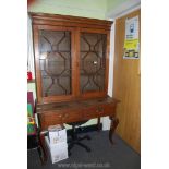 An unusual Oak Writing Table/Bookcase the table having two frieze drawers and standing on stylish